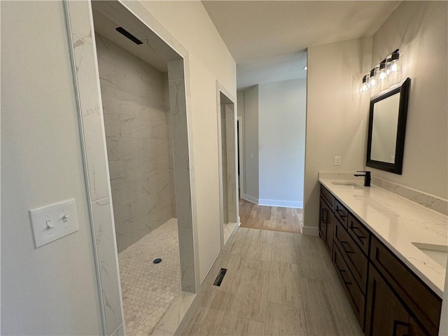 22415 87th Ter, Lenexa, KS 66227 - full bathroom featuring double vanity, a marble finish shower, and baseboards
