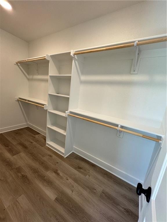22415 87th Ter, Lenexa, KS 66227 - walk in closet featuring dark wood finished floors