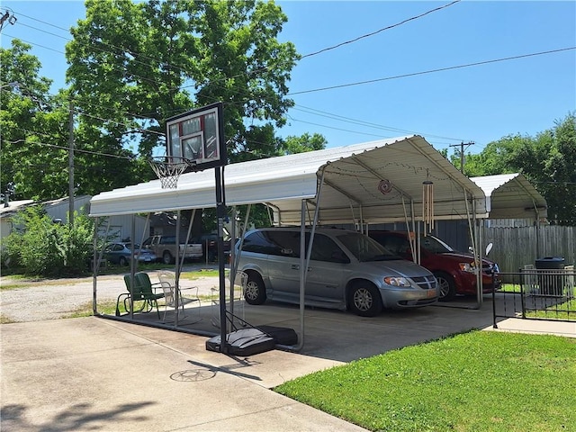 811 W Main St, Chanute, KS 66720 - view of vehicle parking with a detached carport