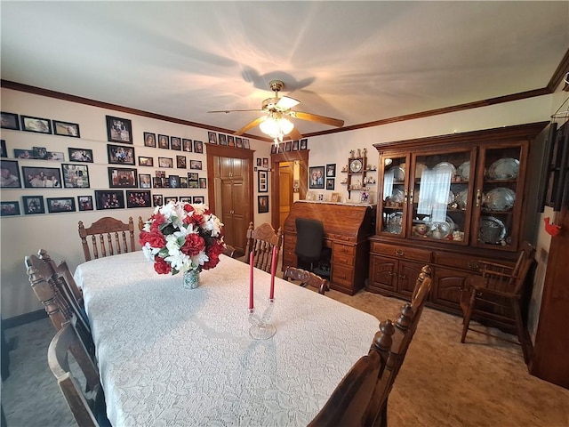 811 W Main St, Chanute, KS 66720 - carpeted dining area featuring a ceiling fan and ornamental molding