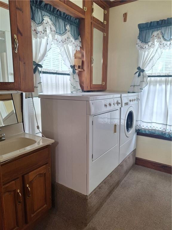 811 W Main St, Chanute, KS 66720 - washroom with washing machine and clothes dryer, healthy amount of natural light, and cabinet space