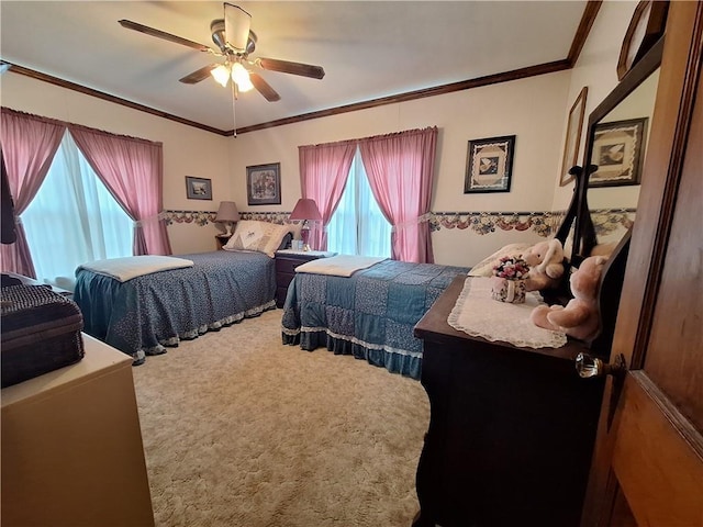 811 W Main St, Chanute, KS 66720 - carpeted bedroom featuring multiple windows, crown molding, and a ceiling fan