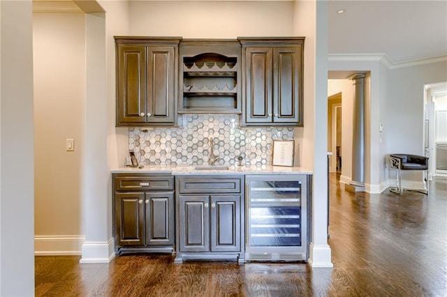 4801 W 133rd St Unit 103, Leawood, KS 66209 - indoor bar featuring wine cooler, dark wood finished floors, backsplash, baseboards, and crown molding