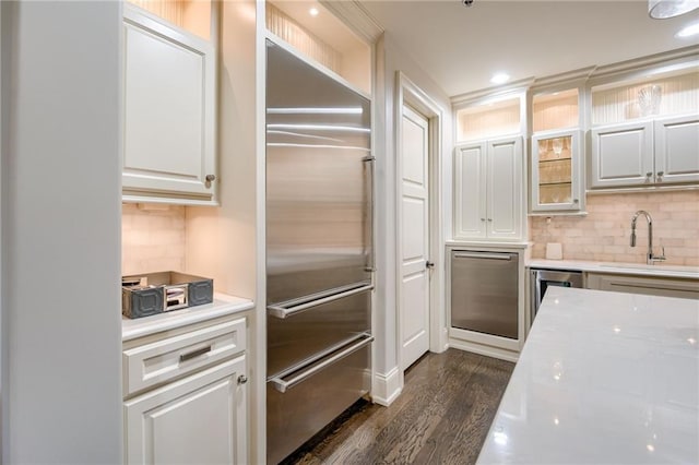 4801 W 133rd St Unit 103, Leawood, KS 66209 - kitchen with stainless steel built in refrigerator, a sink, dark wood-type flooring, decorative backsplash, and recessed lighting