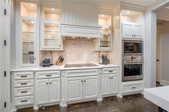 4801 W 133rd St Unit 103, Leawood, KS 66209 - kitchen with appliances with stainless steel finishes, custom range hood, glass insert cabinets, and white cabinets