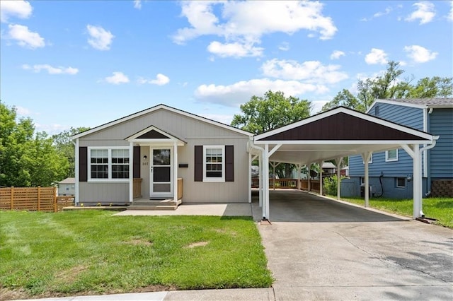 307 E 3rd Dr S, Independence, MO 64050 - view of front of property featuring driveway and a carport