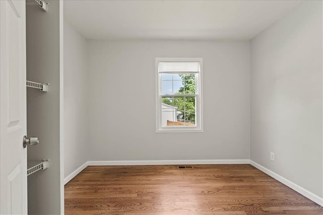 307 E 3rd Dr S, Independence, MO 64050 - unfurnished room with wood finished floors and baseboards