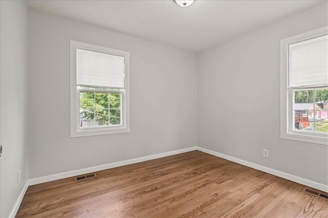 307 E 3rd Dr S, Independence, MO 64050 - empty room featuring wood finished floors and baseboards