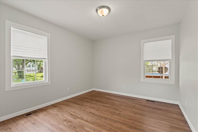 307 E 3rd Dr S, Independence, MO 64050 - unfurnished room with wood finished floors and baseboards
