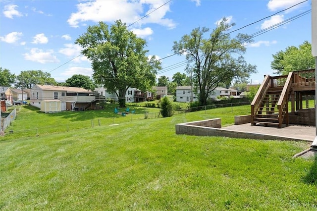 307 E 3rd Dr S, Independence, MO 64050 - view of yard with a residential view, stairway, and a wooden deck
