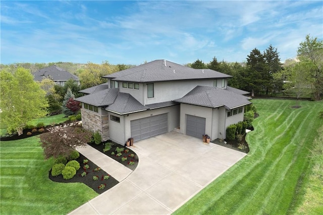 25075 W 105th Ter, Olathe, KS 66061 - view of side of property with a shingled roof, a lawn, concrete driveway, a garage, and view of wooded area