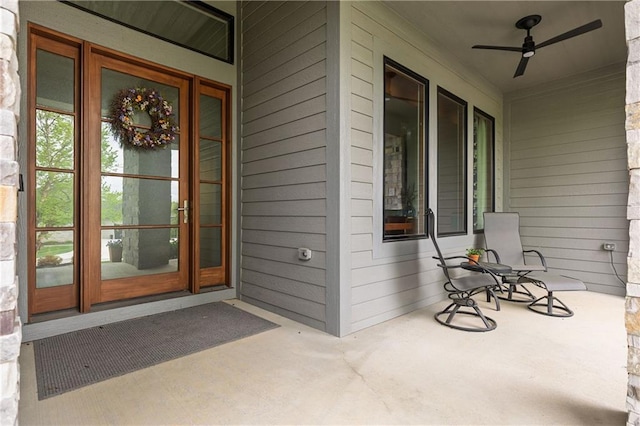 25075 W 105th Ter, Olathe, KS 66061 - property entrance featuring a ceiling fan and covered porch