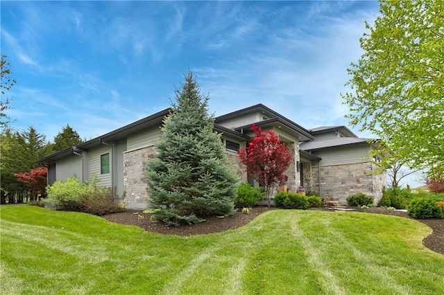 25075 W 105th Ter, Olathe, KS 66061 - view of front of property with stone siding and a front lawn