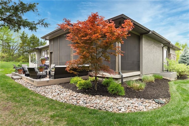 25075 W 105th Ter, Olathe, KS 66061 - view of side of property featuring a lawn and a deck