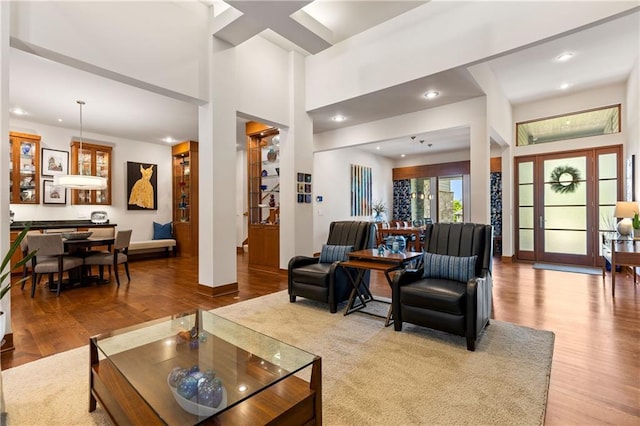 25075 W 105th Ter, Olathe, KS 66061 - living area featuring wood finished floors and recessed lighting