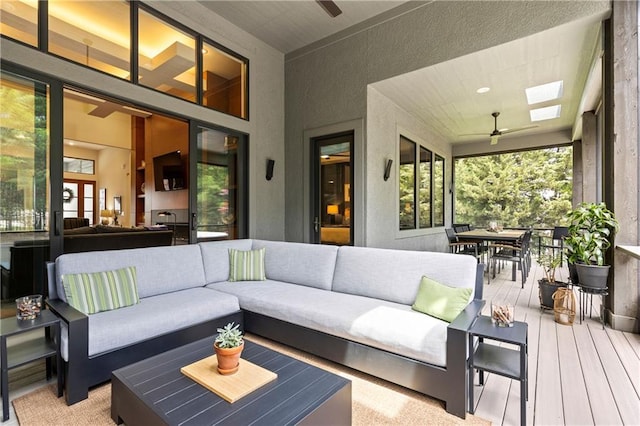 25075 W 105th Ter, Olathe, KS 66061 - deck with a ceiling fan, outdoor dining space, and an outdoor living space