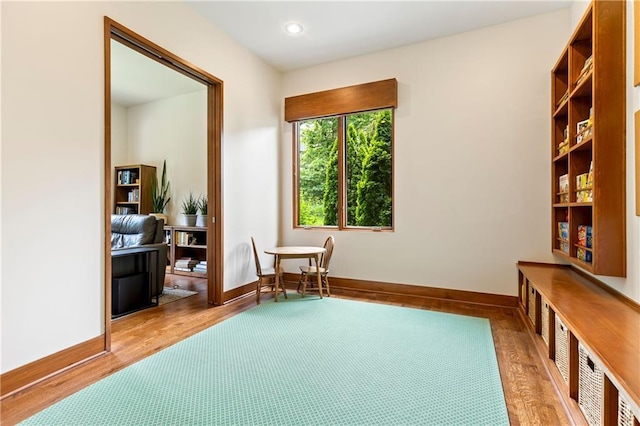 25075 W 105th Ter, Olathe, KS 66061 - living area featuring wood finished floors and recessed lighting