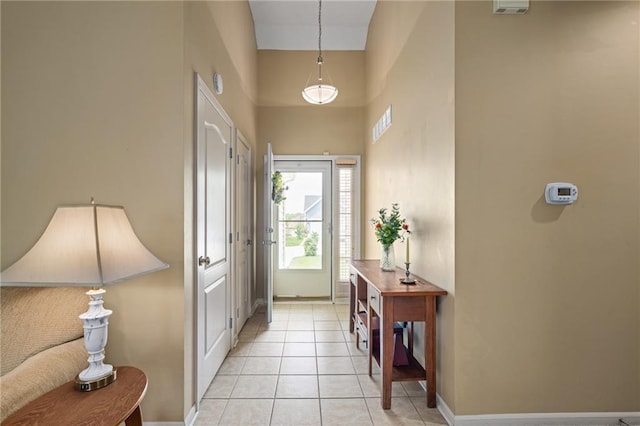14175 W 155th St, Olathe, KS 66062 - foyer entrance with baseboards, light tile patterned flooring, and a towering ceiling