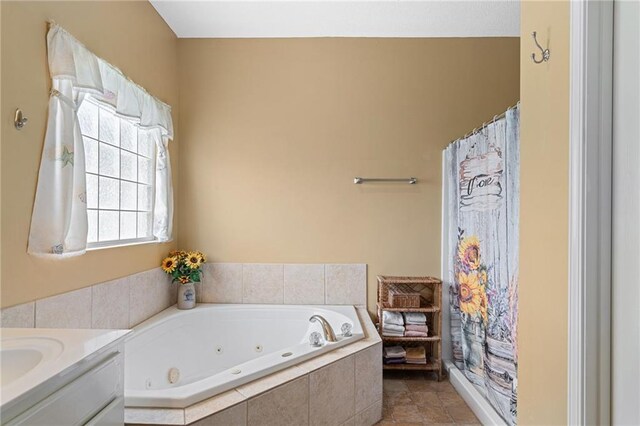 14175 W 155th St, Olathe, KS 66062 - bathroom with a jetted tub, vanity, and a shower with shower curtain