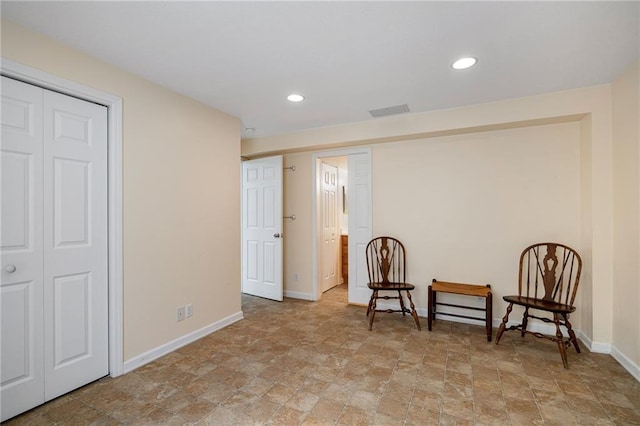14175 W 155th St, Olathe, KS 66062 - sitting room featuring stone finish floors, baseboards, and recessed lighting
