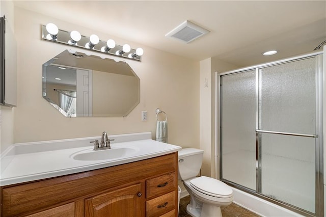 14175 W 155th St, Olathe, KS 66062 - full bathroom featuring vanity, toilet, a shower with shower door, and recessed lighting