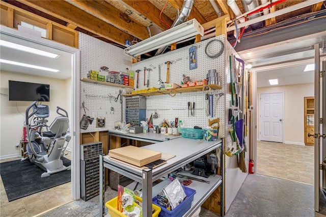 14175 W 155th St, Olathe, KS 66062 - below grade area featuring a workshop area and baseboards
