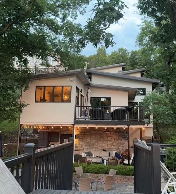 53 Z St, Lees Summit, MO 64086 - back of property featuring a balcony and stucco siding