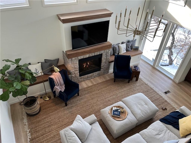 53 Z St, Lees Summit, MO 64086 - living room with wood finished floors and a stone fireplace