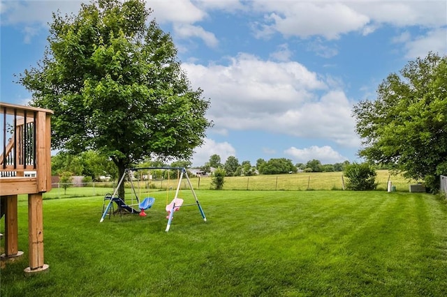 706 S Sunset Ln, Raymore, MO 64083 - view of yard with a playground