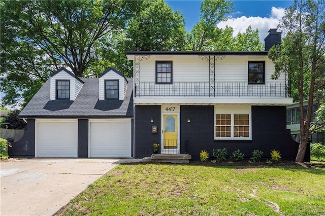 4417 E 104th St, Kansas City, MO 64137 - view of front of home featuring a garage, a front lawn, driveway, and brick siding