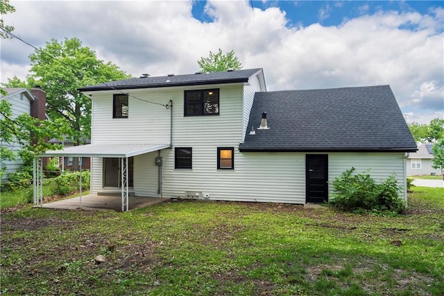 4417 E 104th St, Kansas City, MO 64137 - rear view of house featuring a patio area, a yard, and roof with shingles