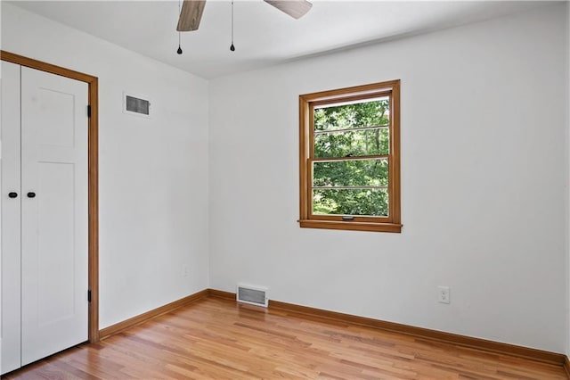 4417 E 104th St, Kansas City, MO 64137 - spare room featuring light wood-type flooring, baseboards, and ceiling fan