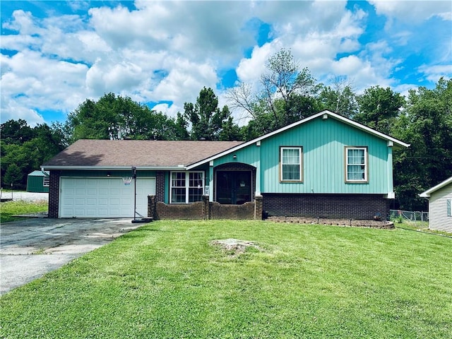 207 W Birch Dr, Windsor, MO 65360 - split level home with an attached garage, concrete driveway, and brick siding