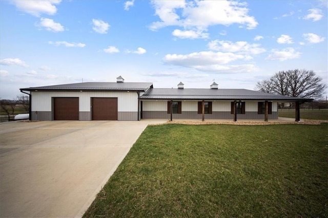 690 SW T Hwy, Holden, MO 64040 - view of front of property with a garage, a front yard, driveway, and metal roof