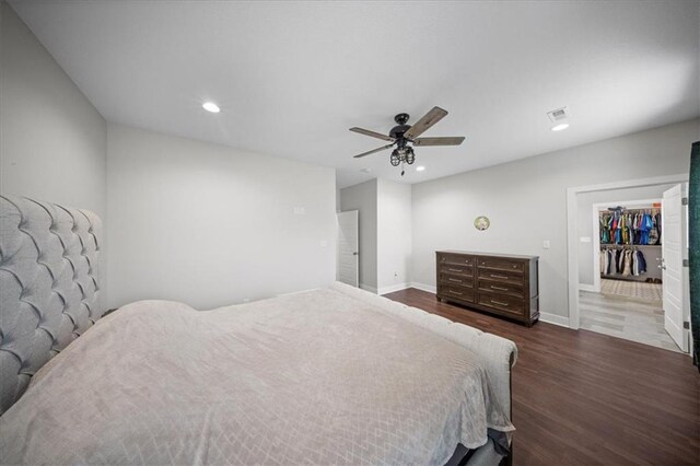 690 SW T Hwy, Holden, MO 64040 - bedroom with dark wood-type flooring, recessed lighting, ceiling fan, and baseboards