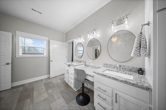 690 SW T Hwy, Holden, MO 64040 - bathroom featuring double vanity and baseboards
