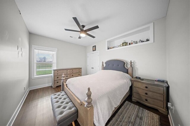 690 SW T Hwy, Holden, MO 64040 - bedroom with baseboards, dark wood-type flooring, and ceiling fan