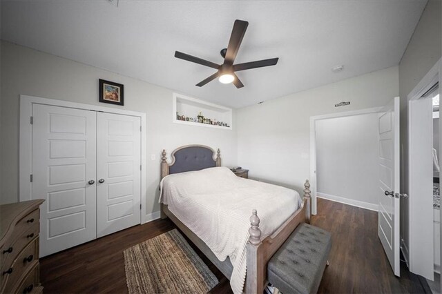 690 SW T Hwy, Holden, MO 64040 - bedroom with a closet, dark wood finished floors, a ceiling fan, and baseboards