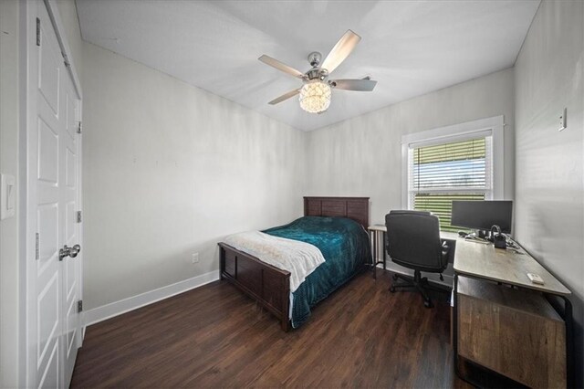 690 SW T Hwy, Holden, MO 64040 - bedroom with wood finished floors, a desk, baseboards, and a ceiling fan