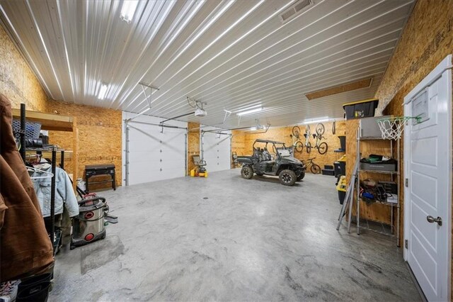 690 SW T Hwy, Holden, MO 64040 - garage featuring a garage door opener