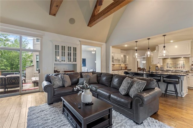 9300 W 156th Pl, Overland Park, KS 66221 - living room with beam ceiling, high vaulted ceiling, and hardwood / wood-style flooring