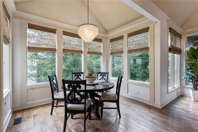 9300 W 156th Pl, Overland Park, KS 66221 - sunroom with lofted ceiling, a chandelier, wood-type flooring, and baseboards