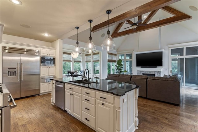 9300 W 156th Pl, Overland Park, KS 66221 - kitchen with built in appliances, high vaulted ceiling, a warming drawer, ceiling fan, and a sink