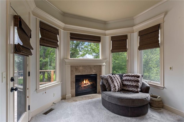 9300 W 156th Pl, Overland Park, KS 66221 - sitting room with carpet floors, a tiled fireplace, crown molding, and healthy amount of natural light