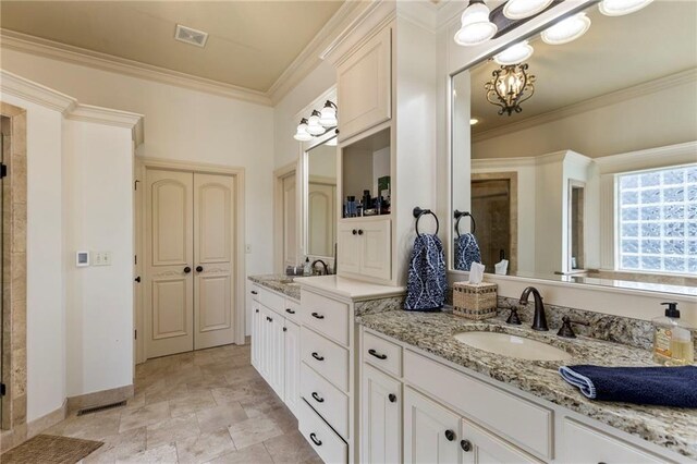 9300 W 156th Pl, Overland Park, KS 66221 - bathroom with double vanity, baseboards, ornamental molding, a chandelier, and a shower