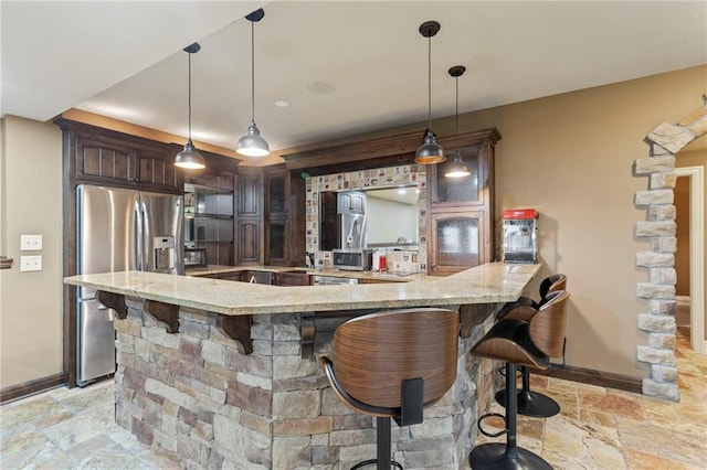 9300 W 156th Pl, Overland Park, KS 66221 - kitchen featuring stainless steel refrigerator with ice dispenser, stone tile floors, and baseboards