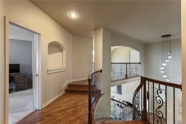 9300 W 156th Pl, Overland Park, KS 66221 - hall featuring an upstairs landing, wood finished floors, baseboards, and recessed lighting