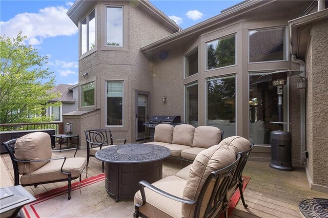 9300 W 156th Pl, Overland Park, KS 66221 - wooden deck with an outdoor hangout area and grilling area