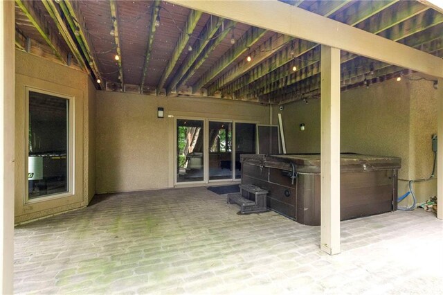 9300 W 156th Pl, Overland Park, KS 66221 - view of patio / terrace with a hot tub