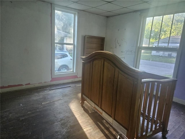 303 W Park St, Pittsburg, KS 66762 - bedroom with a paneled ceiling, hardwood / wood-style flooring, and baseboards